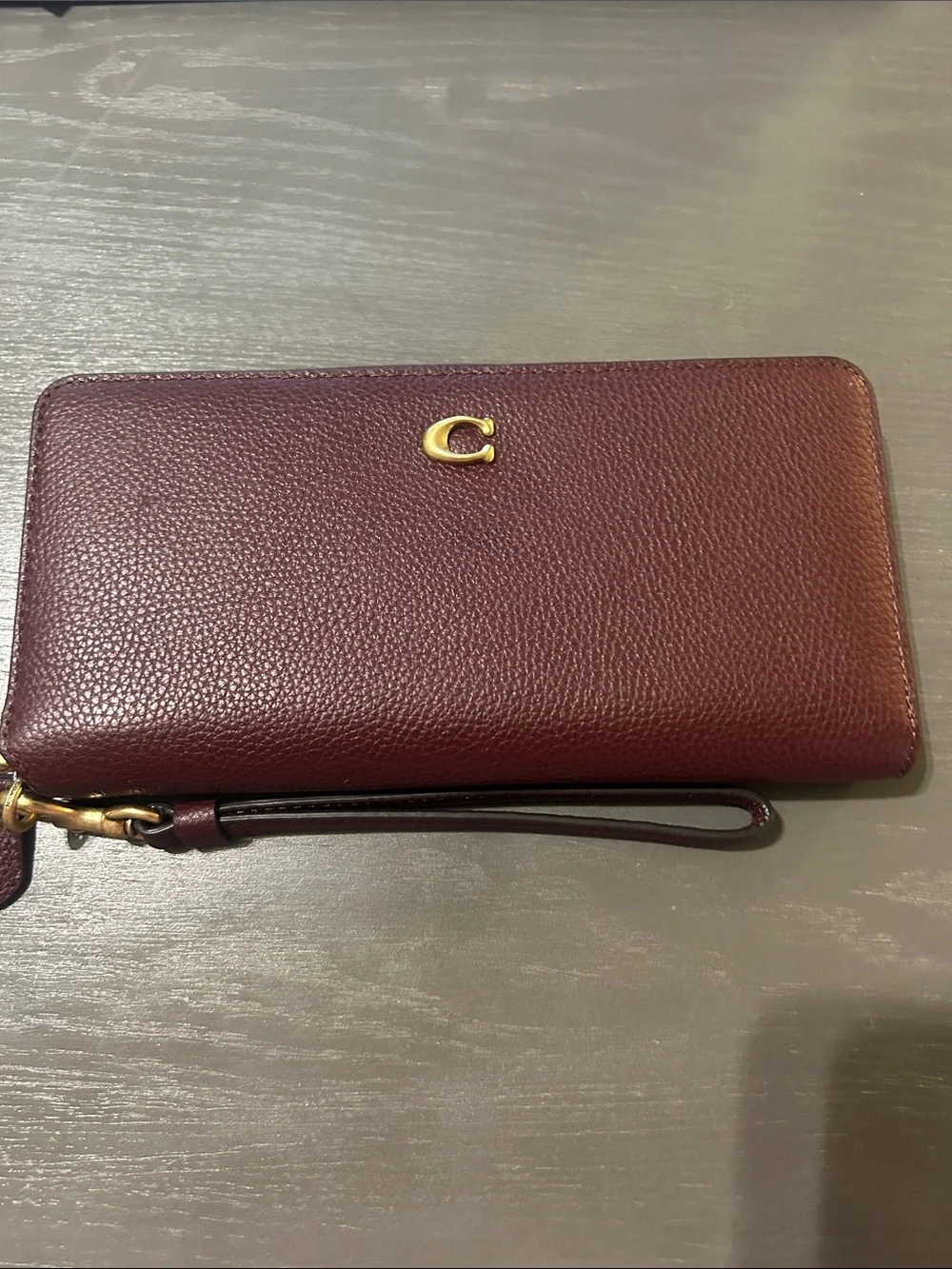 Coach Burgundy Pebbled Leather Zip-Around Wristlet Wallet with Gold 'C'